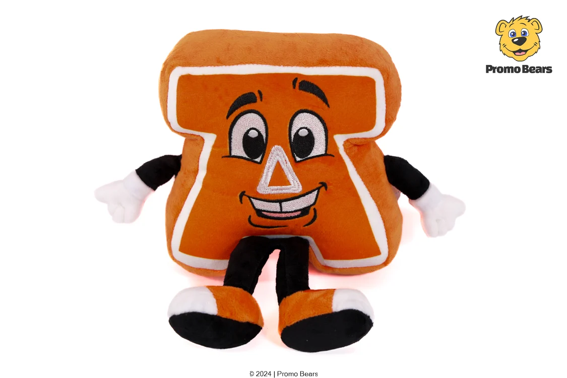 Orange plush toy shaped like a slice of bread with a smiling face, arms and legs, and a white border outline.--Promo Bears mascot